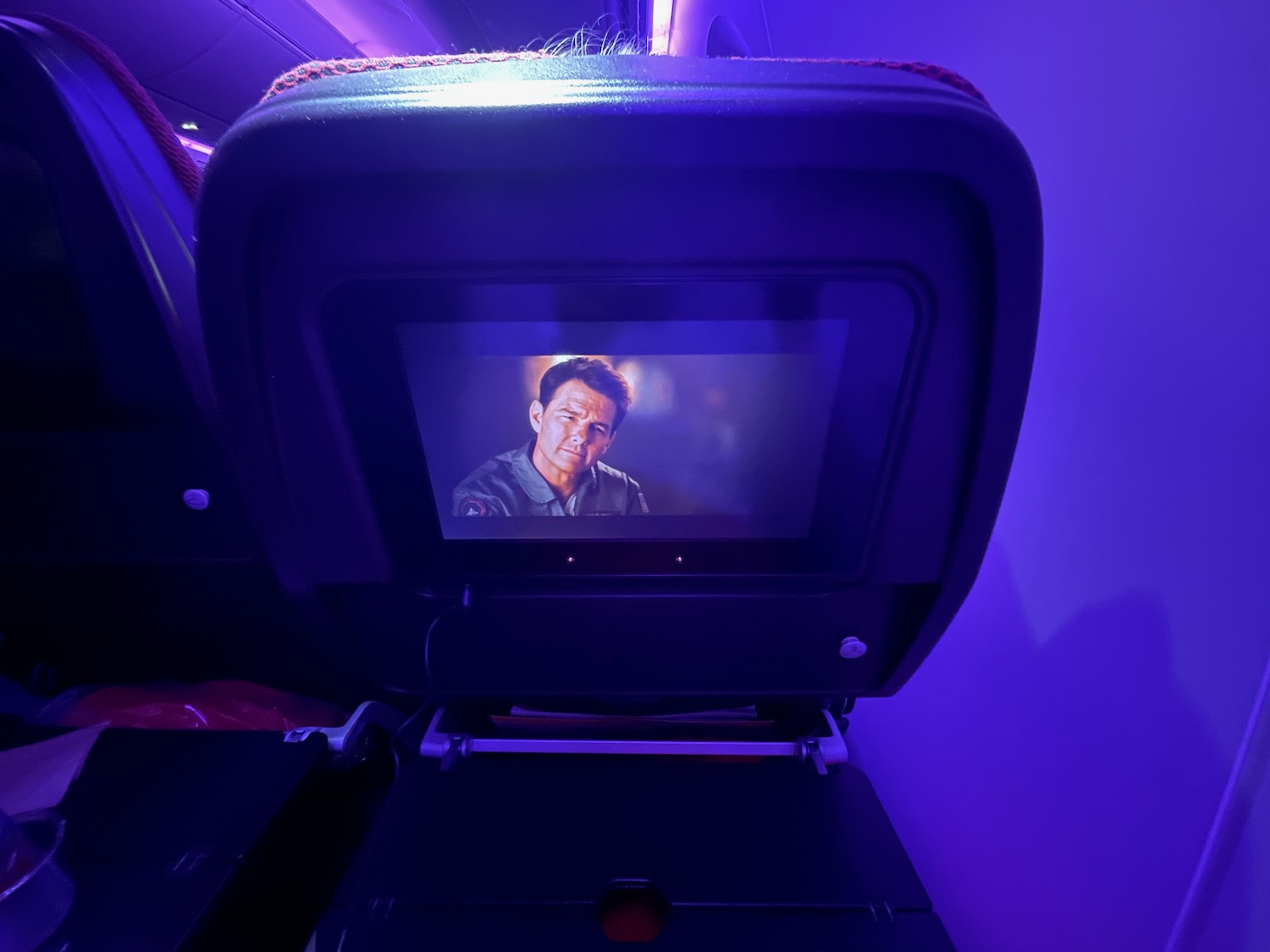 a tv screen on an airplane