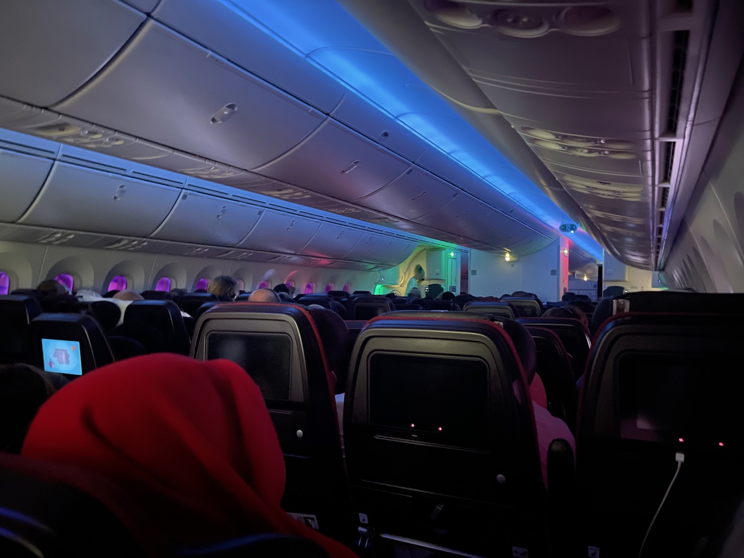 inside an airplane with seats and lights