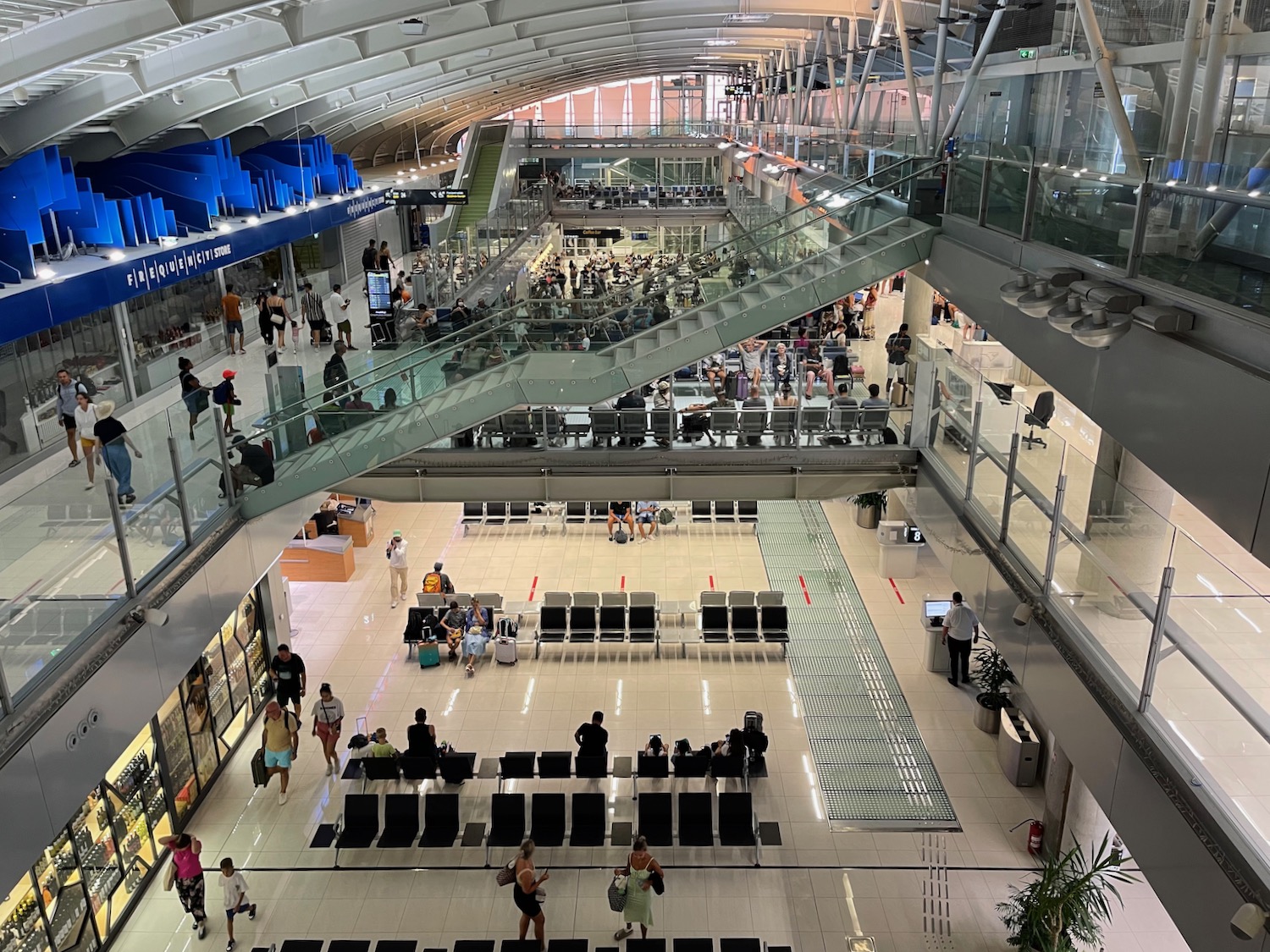 a large building with many people and stairs