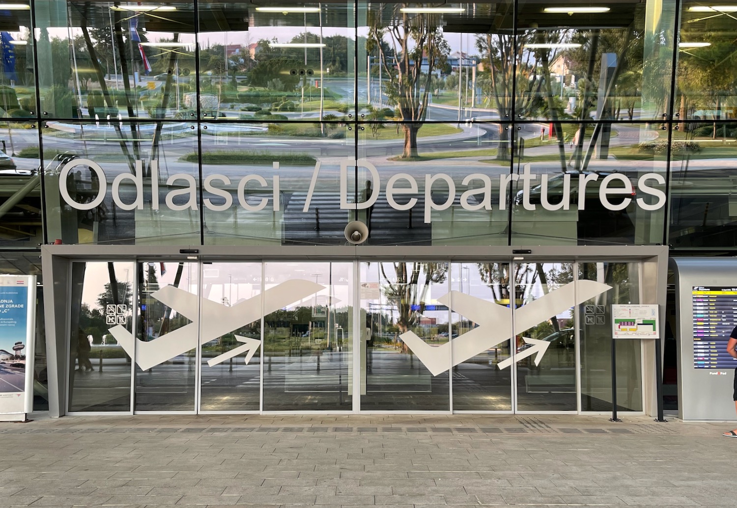 a glass building with windows and signs