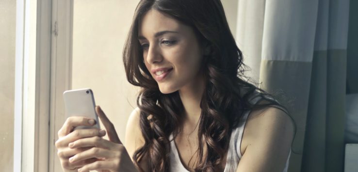 a woman looking at her phone