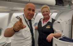 a man and woman in uniform pointing at something