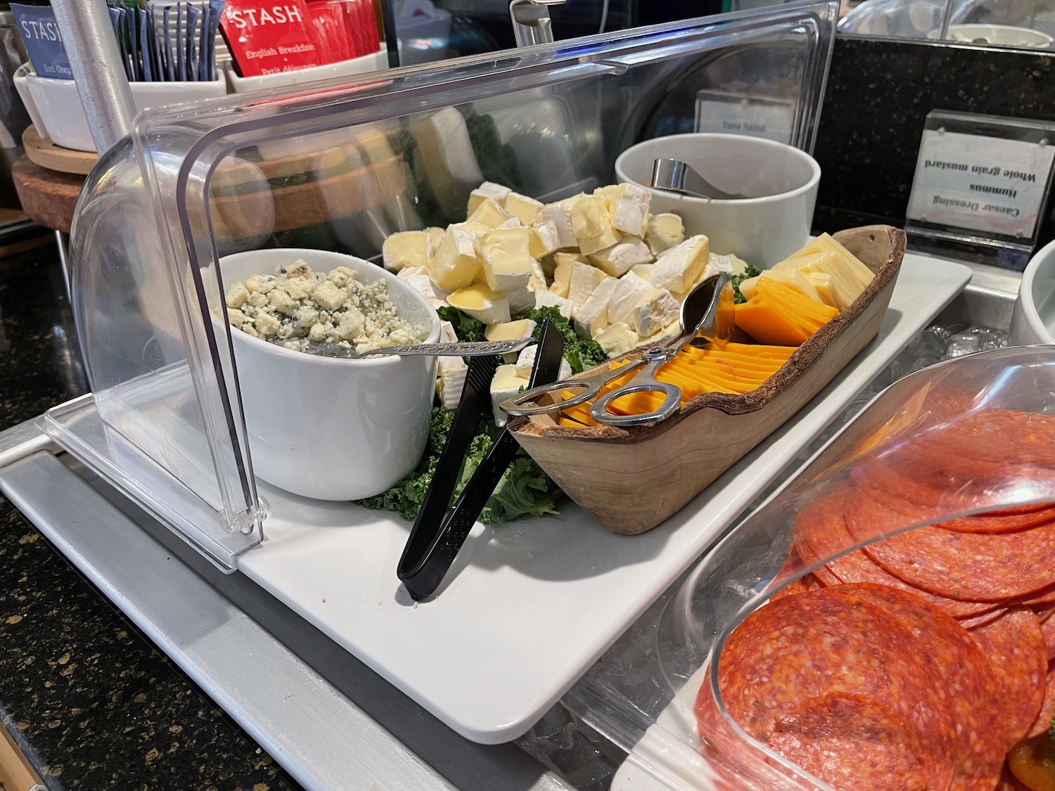 a tray of cheese and salad