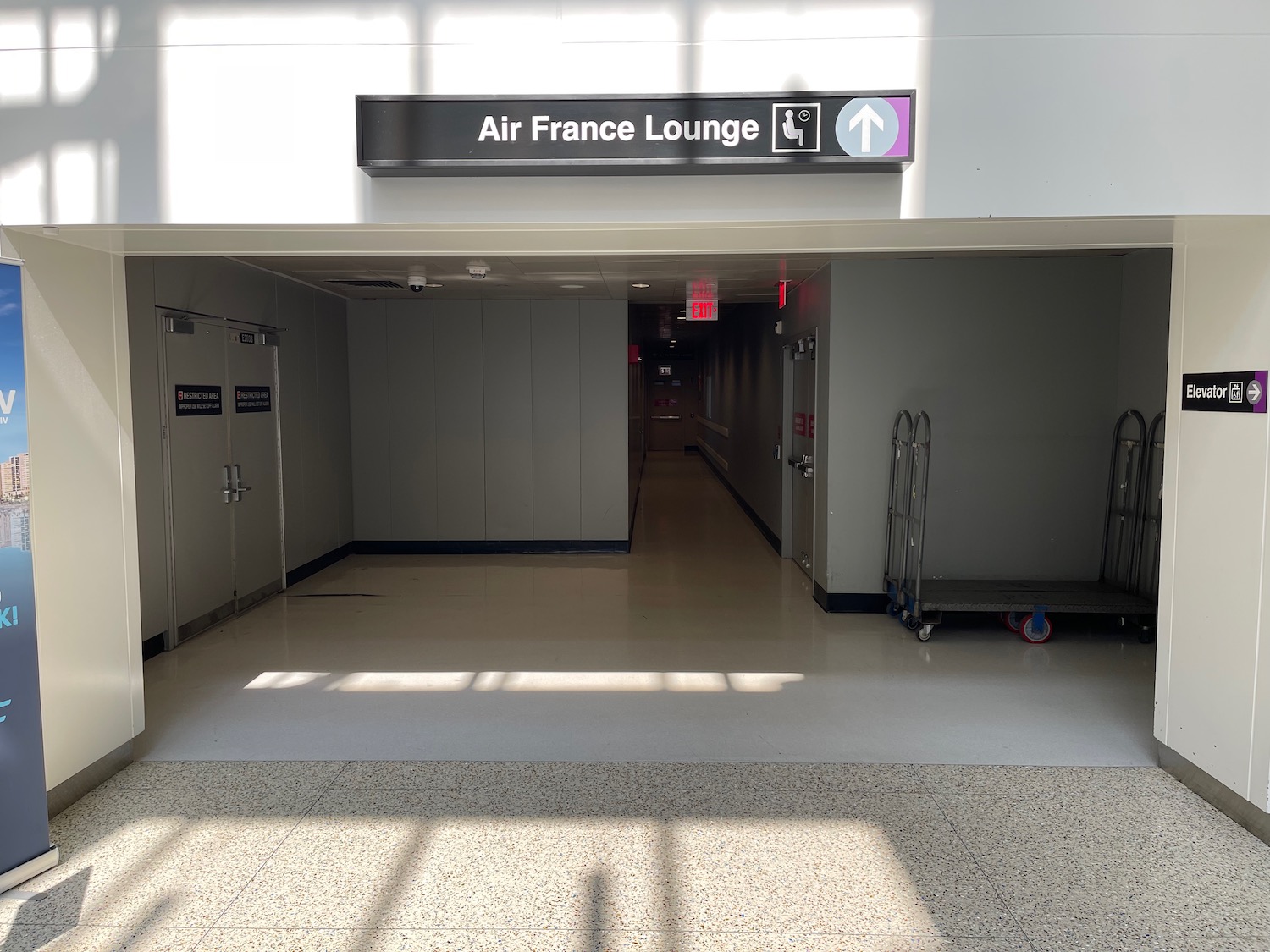 an airport terminal with a sign