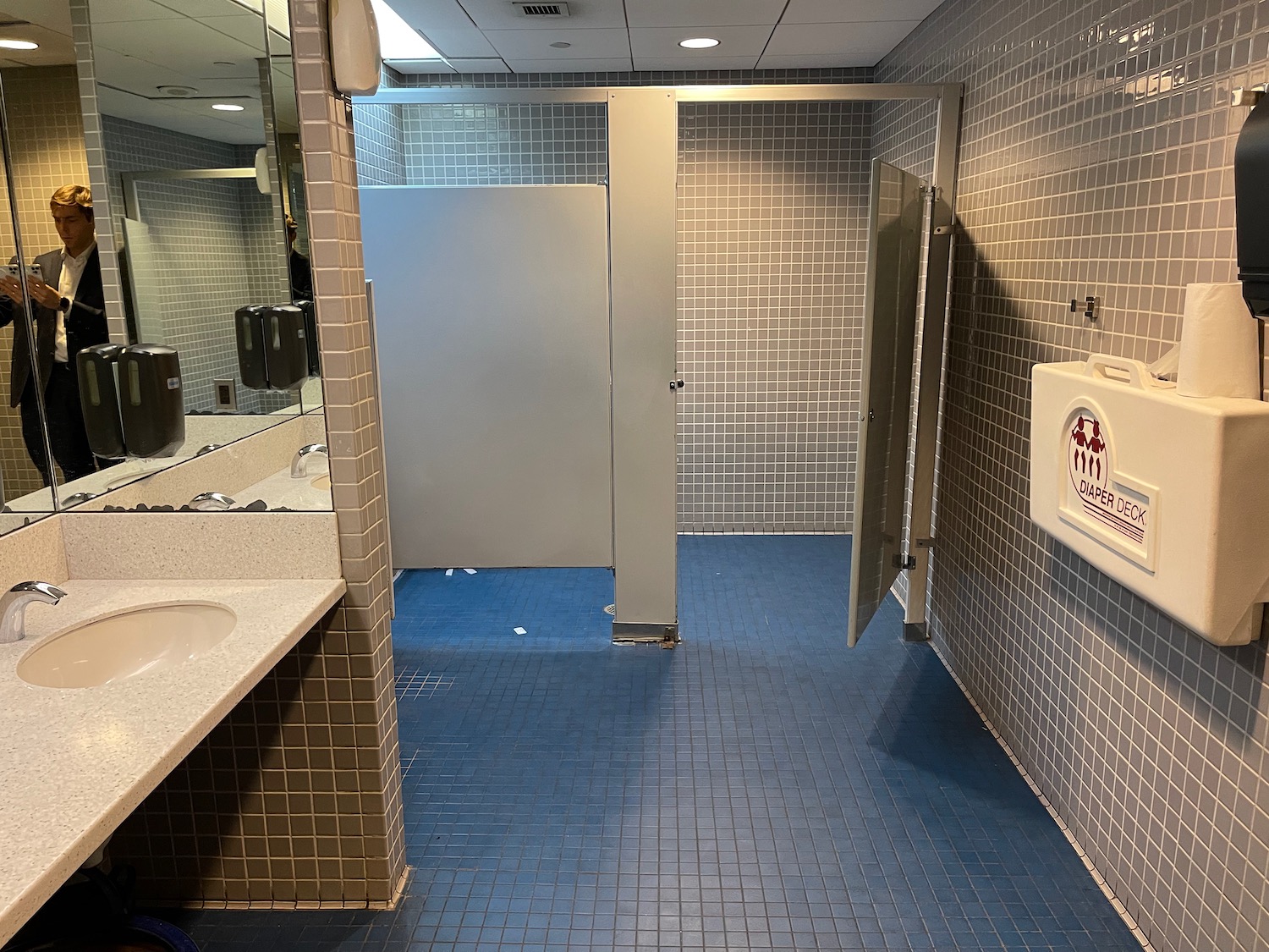 a bathroom with a door and a sink