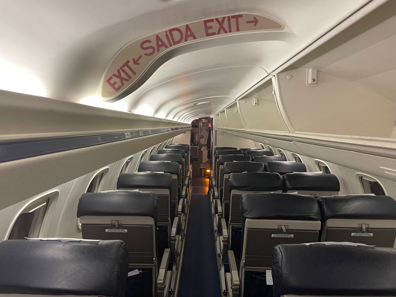 an airplane with seats and a sign