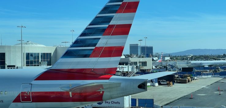 an airplane with a red white and blue stripe on it