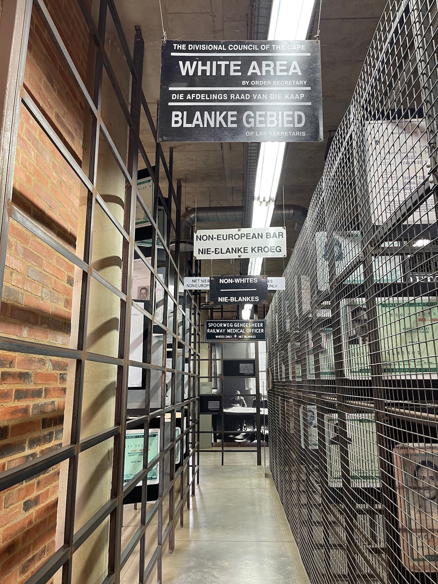 a metal cage with signs on it