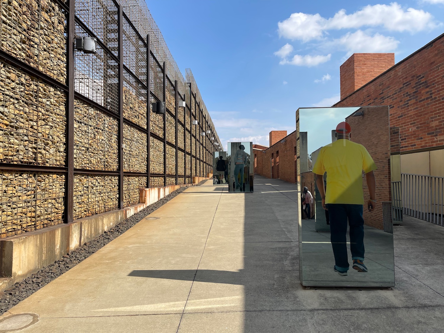 a walkway with a mirror on it