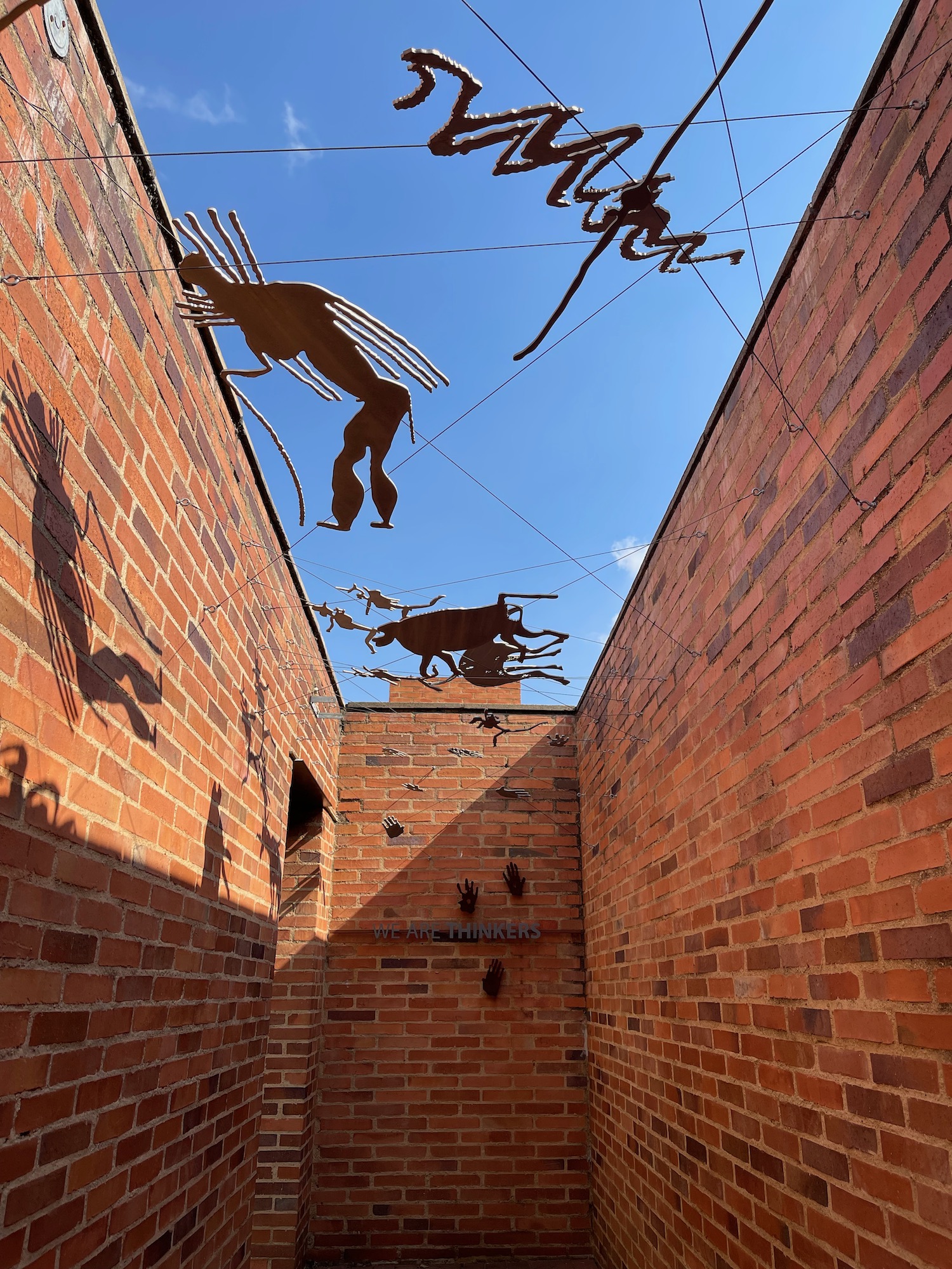 a brick wall with a group of insects on it