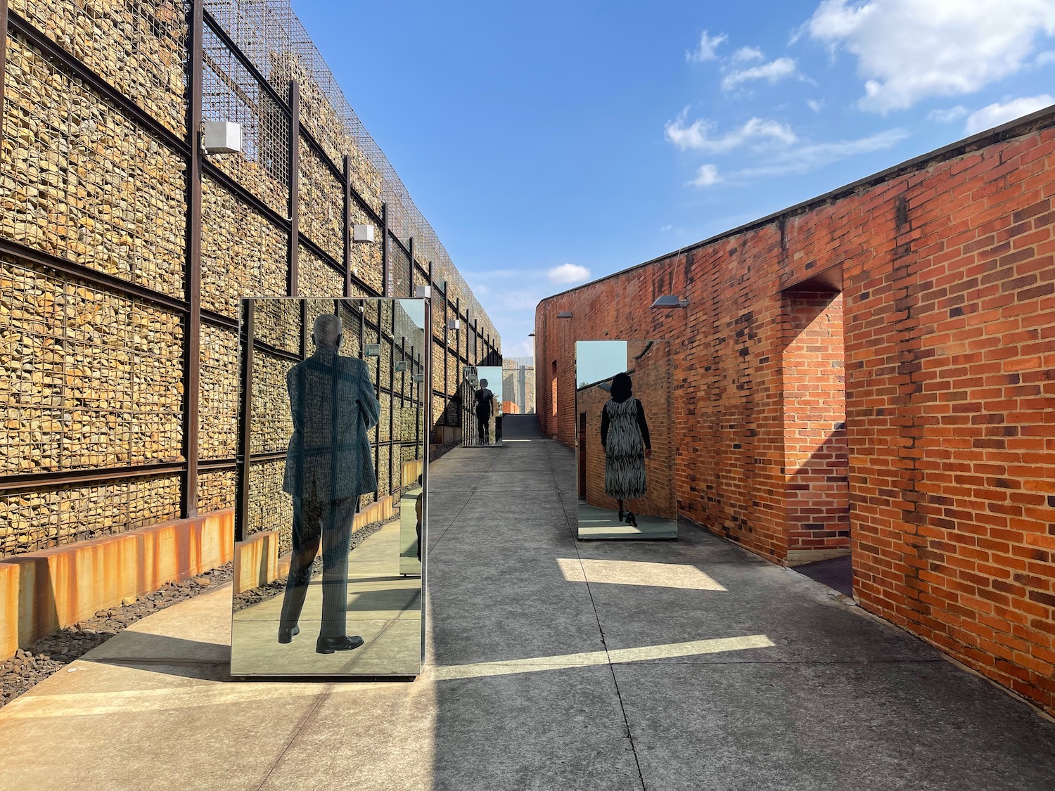 a couple of mirrors in a walkway