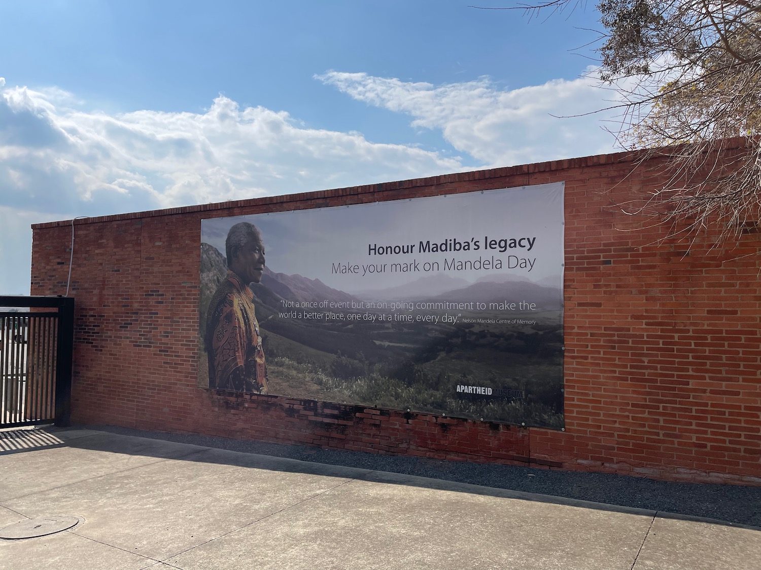 a brick wall with a poster on it