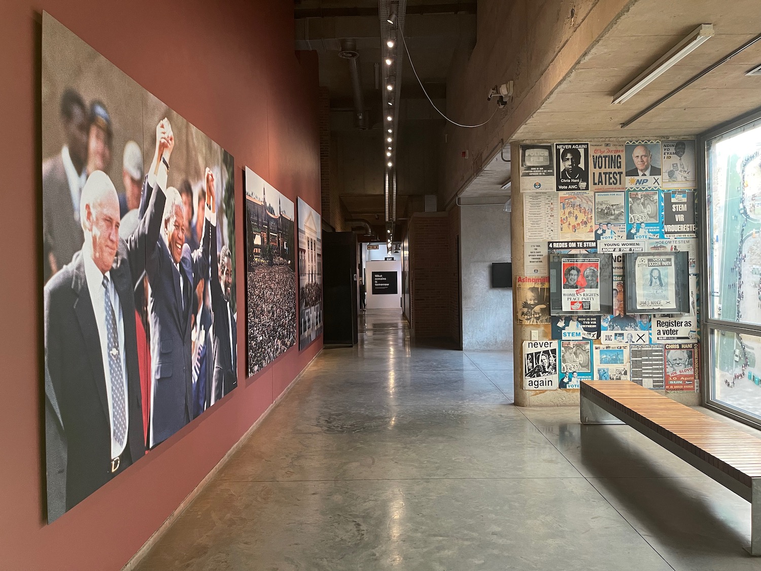 a hallway with posters on the wall