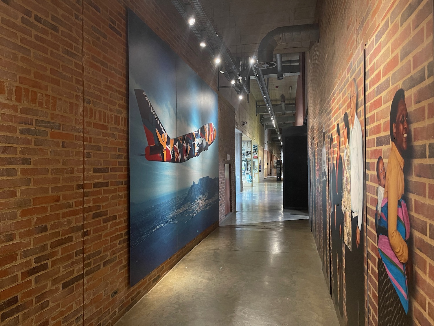 a hallway with a painting on the wall