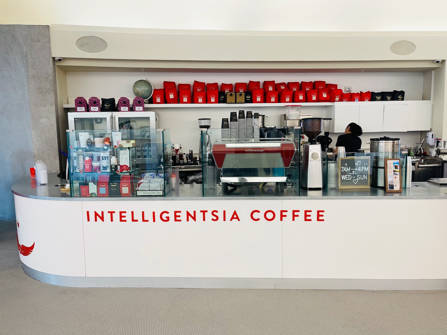 a counter with a variety of coffee machines