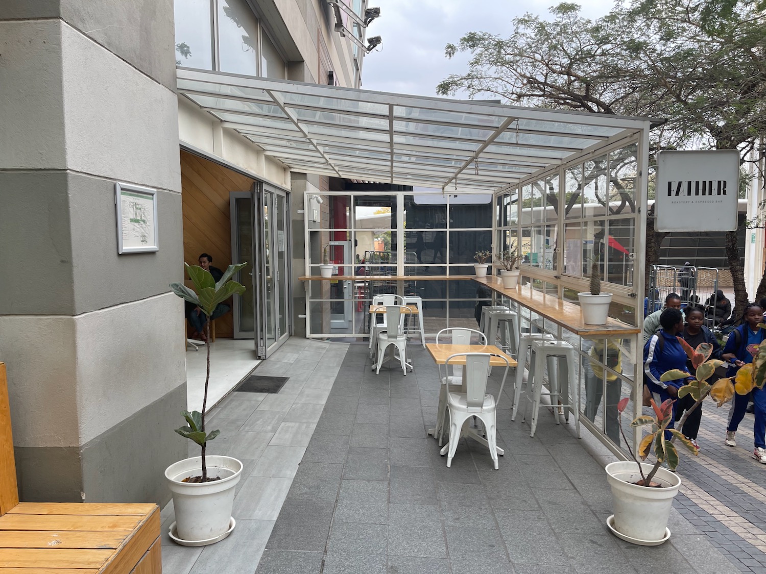 a patio with tables and chairs