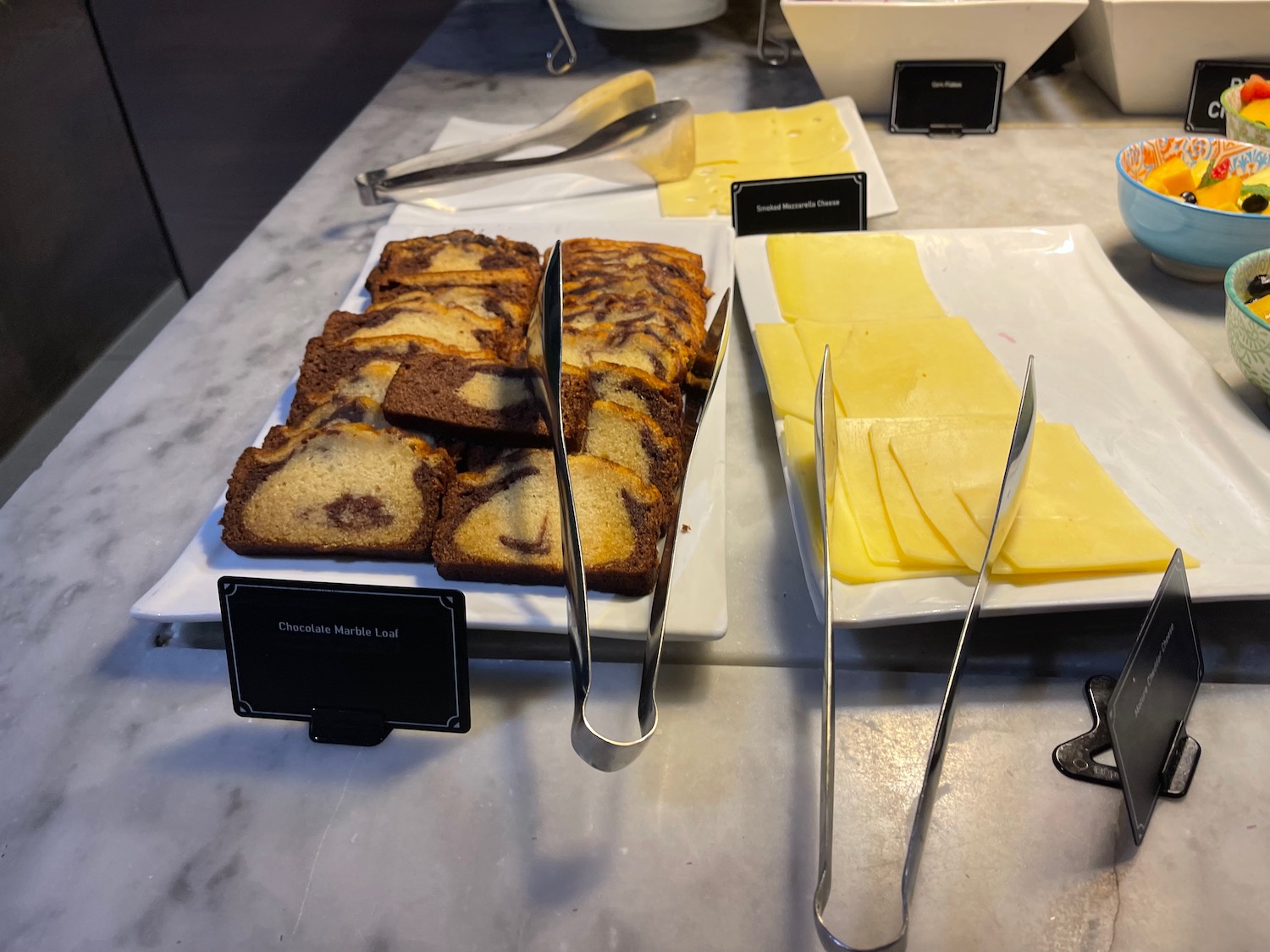 a plate of bread and cheese on a counter