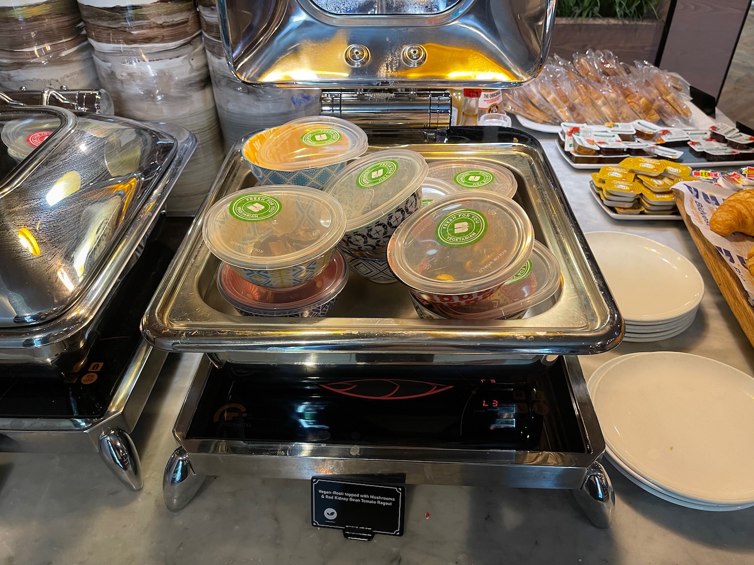 a group of food containers in a buffet