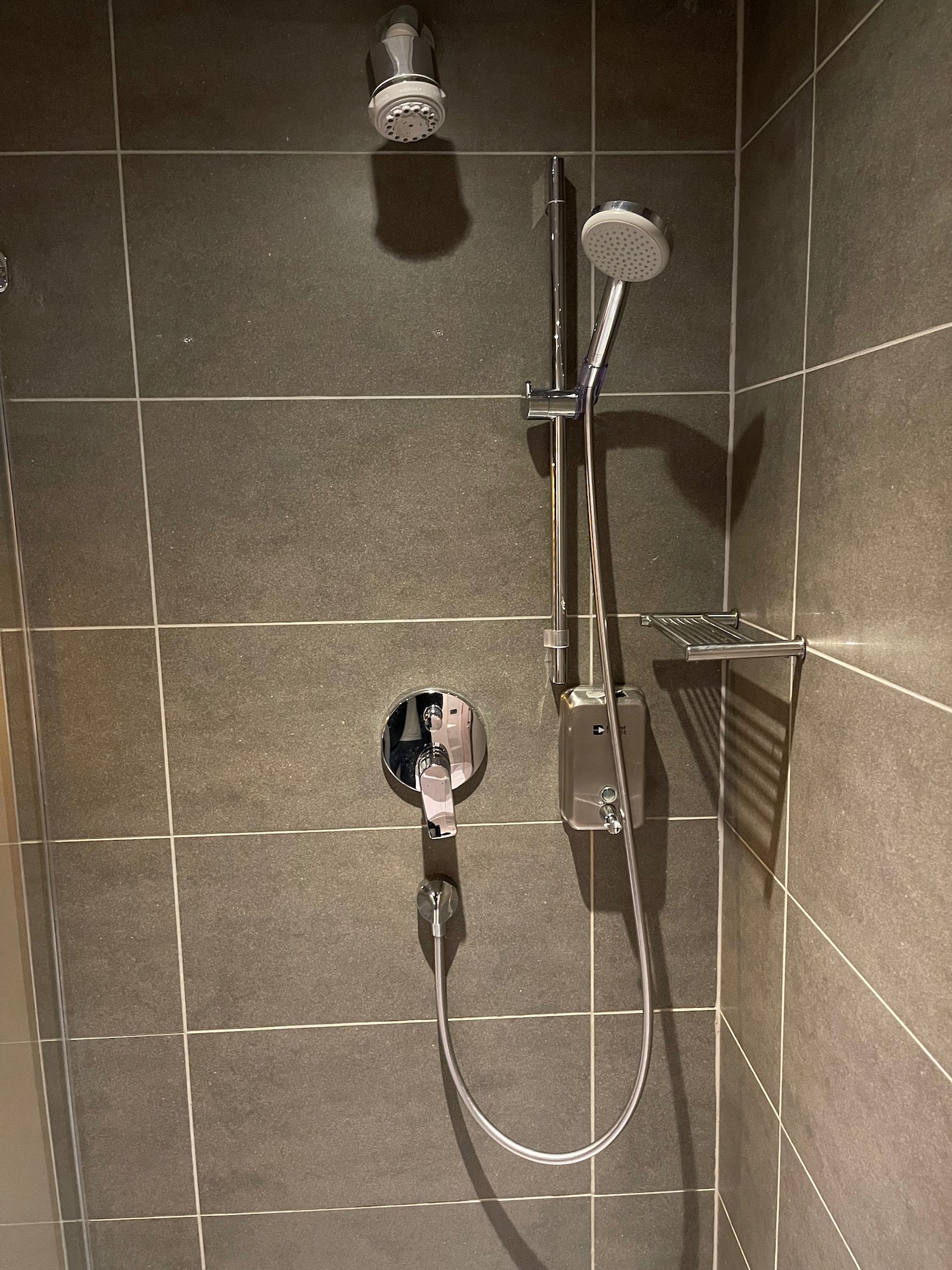 a shower head and shower head in a bathroom