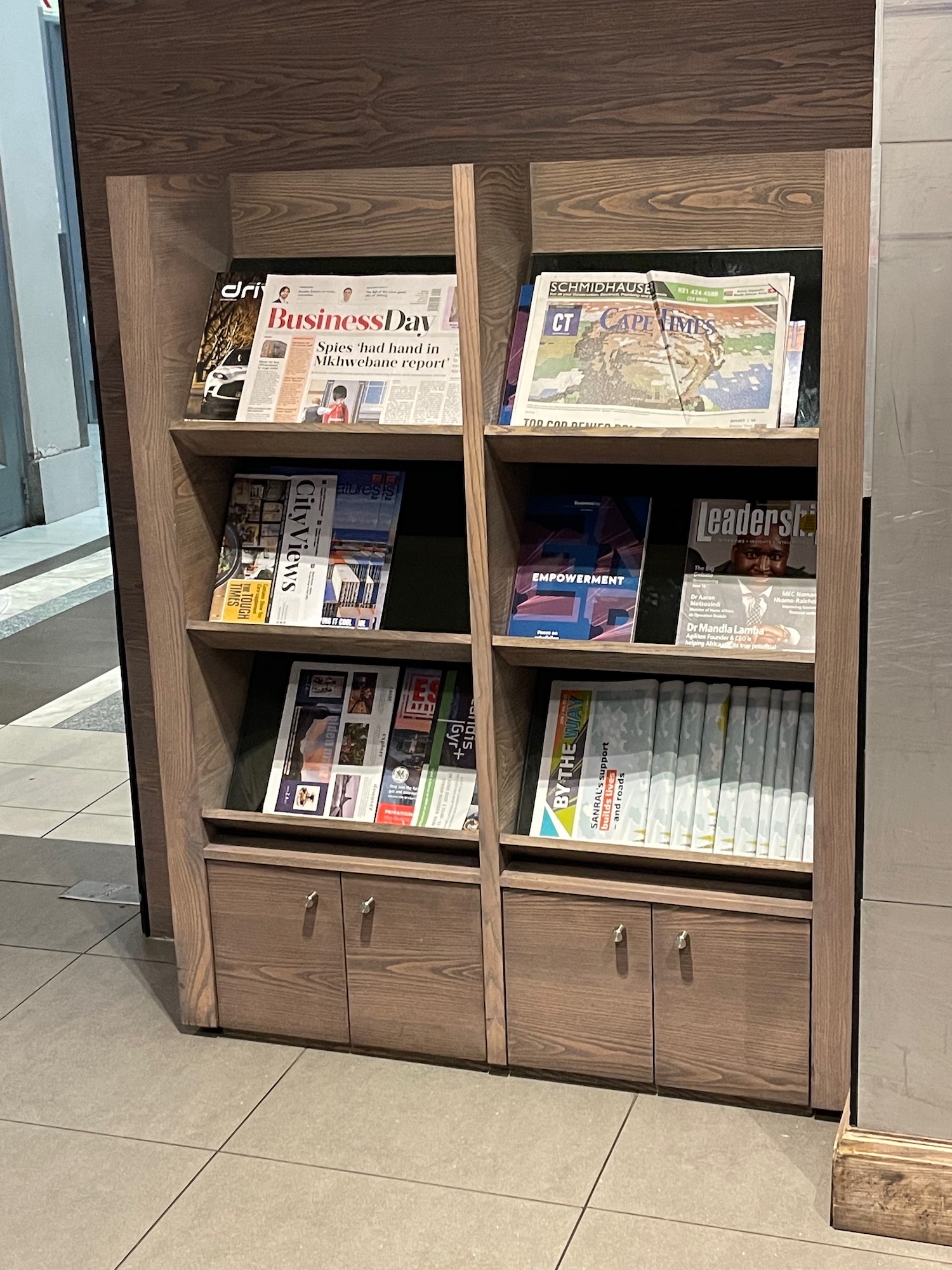 a wooden bookcase with several books on it