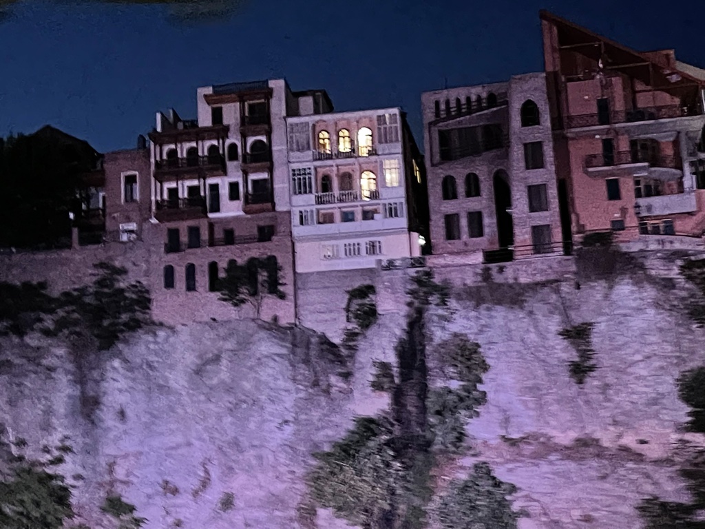 a group of buildings on a cliff