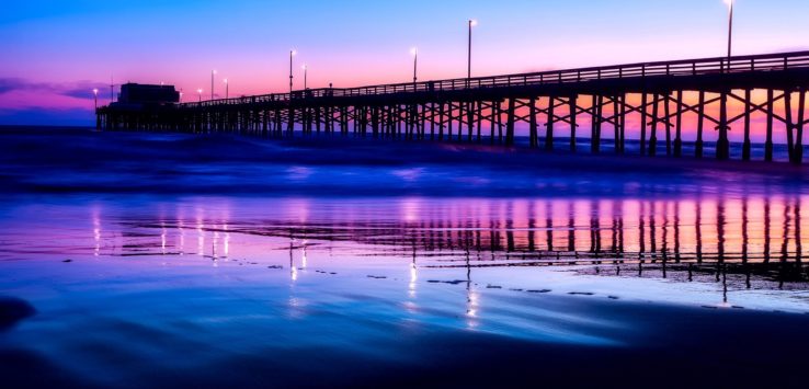 a pier with lights on it