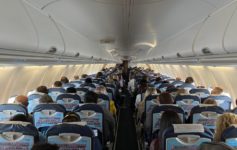 a group of people sitting in an airplane