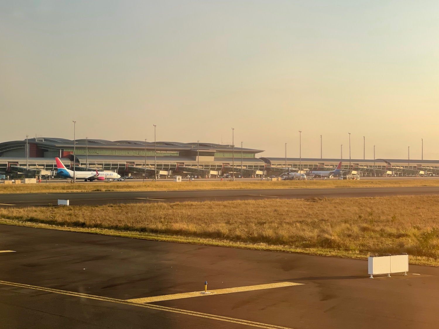 a runway with airplanes on it