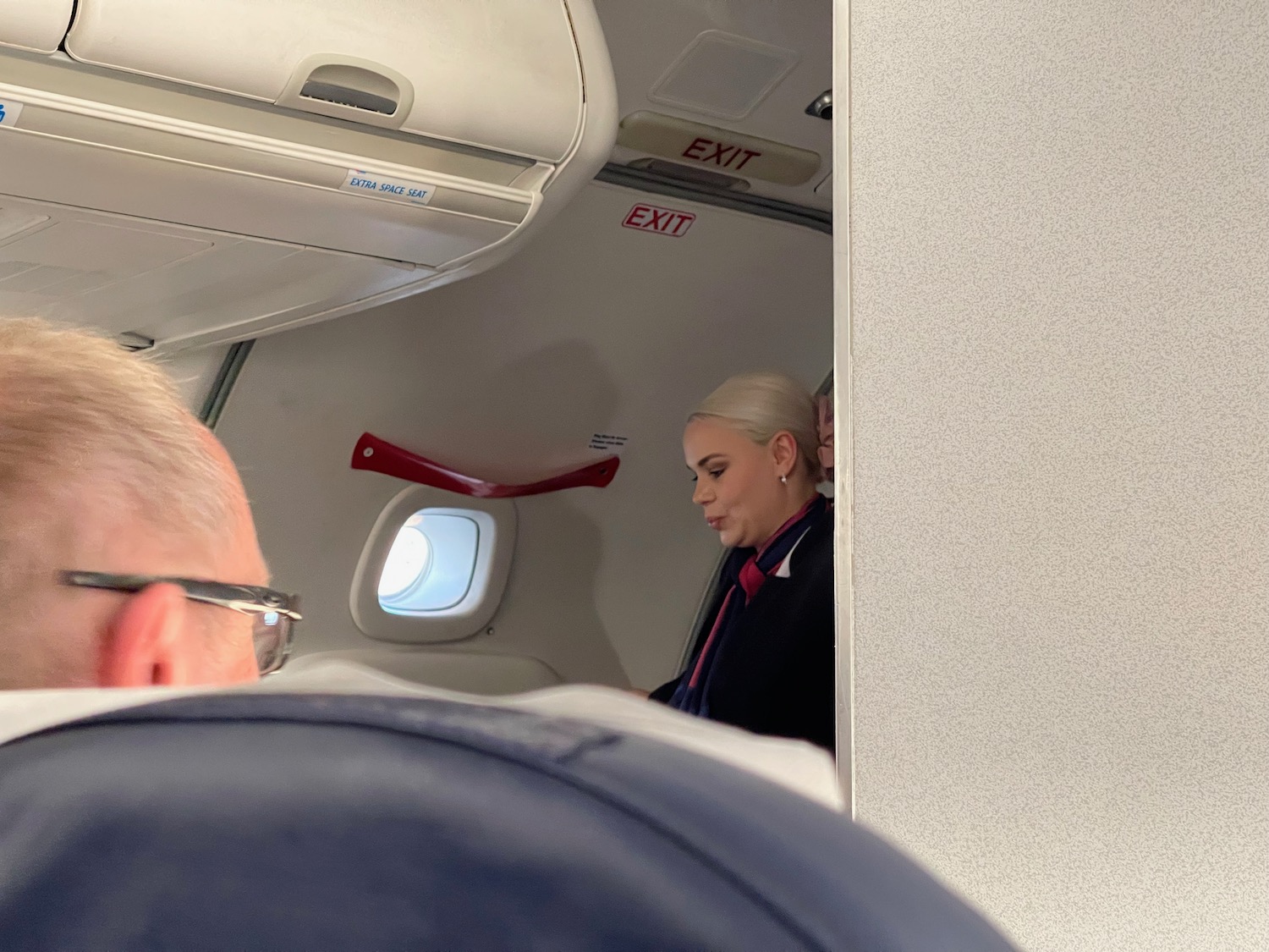 a woman sitting in an airplane