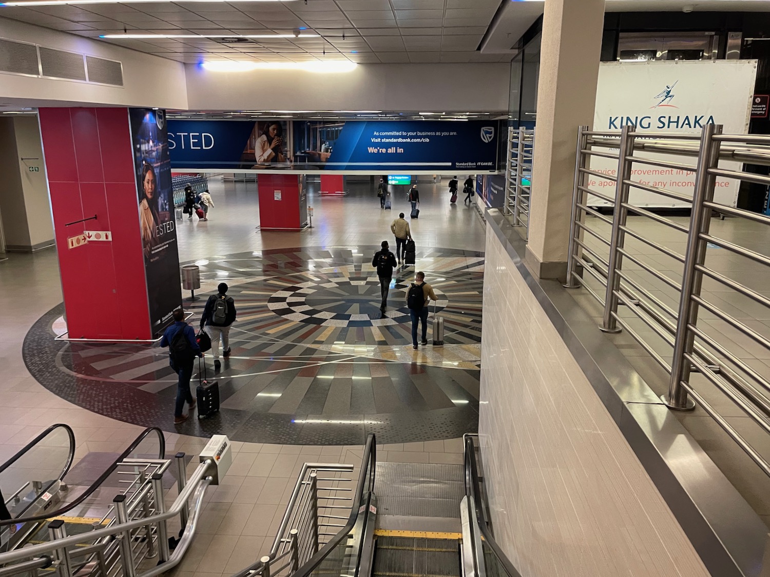 a group of people walking in a large building