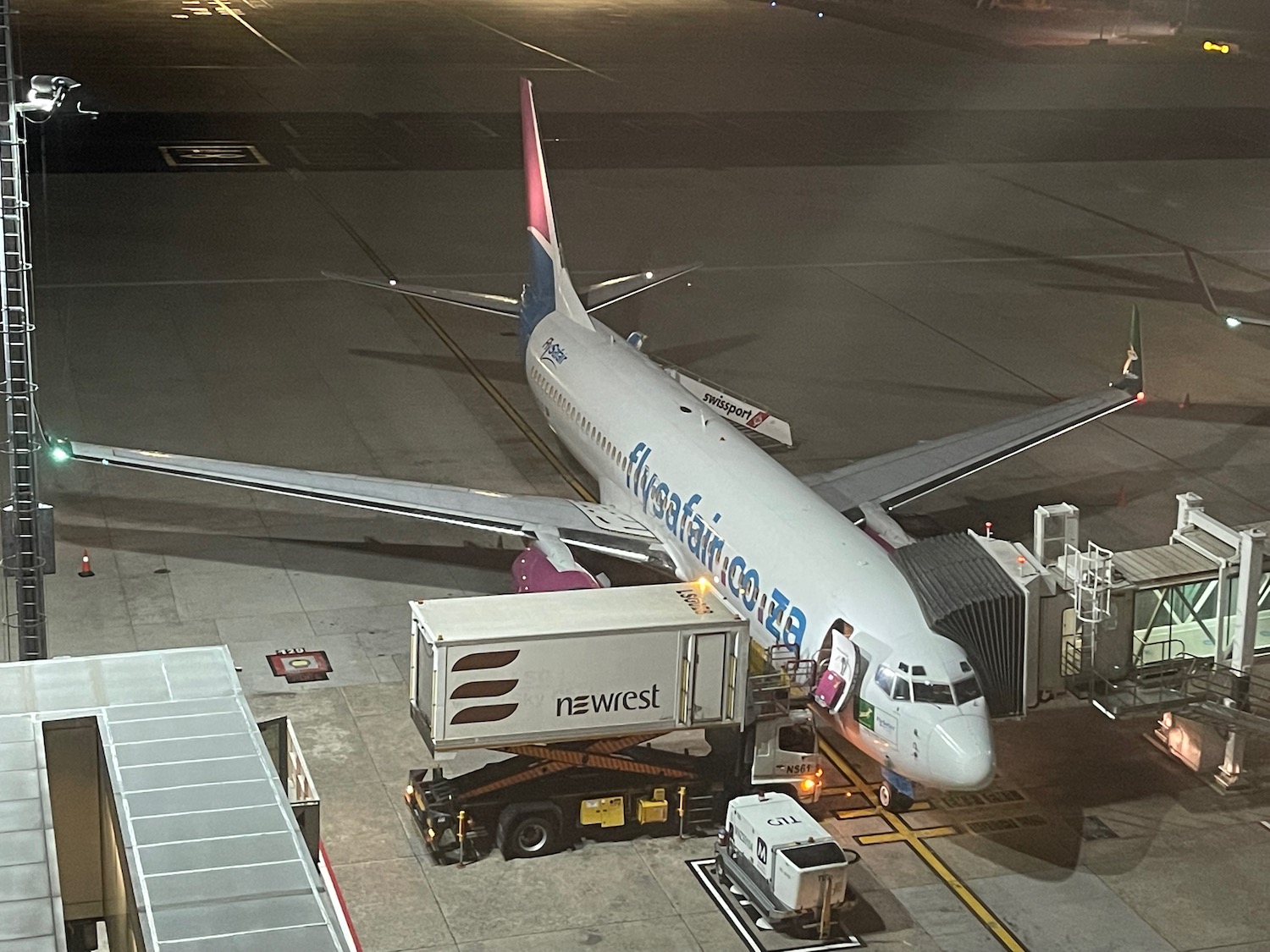 an airplane on the tarmac at night