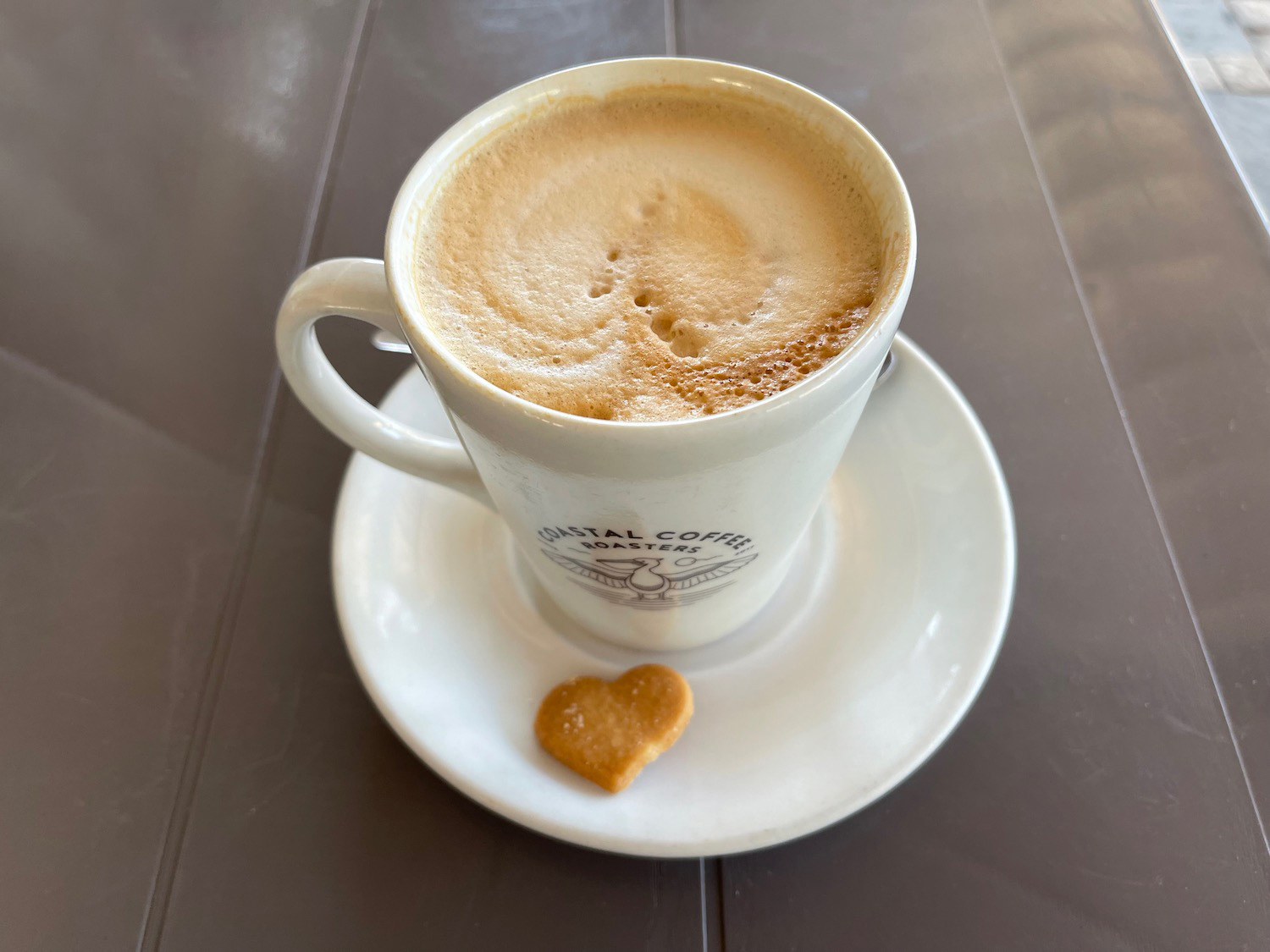 a cup of coffee and a cookie