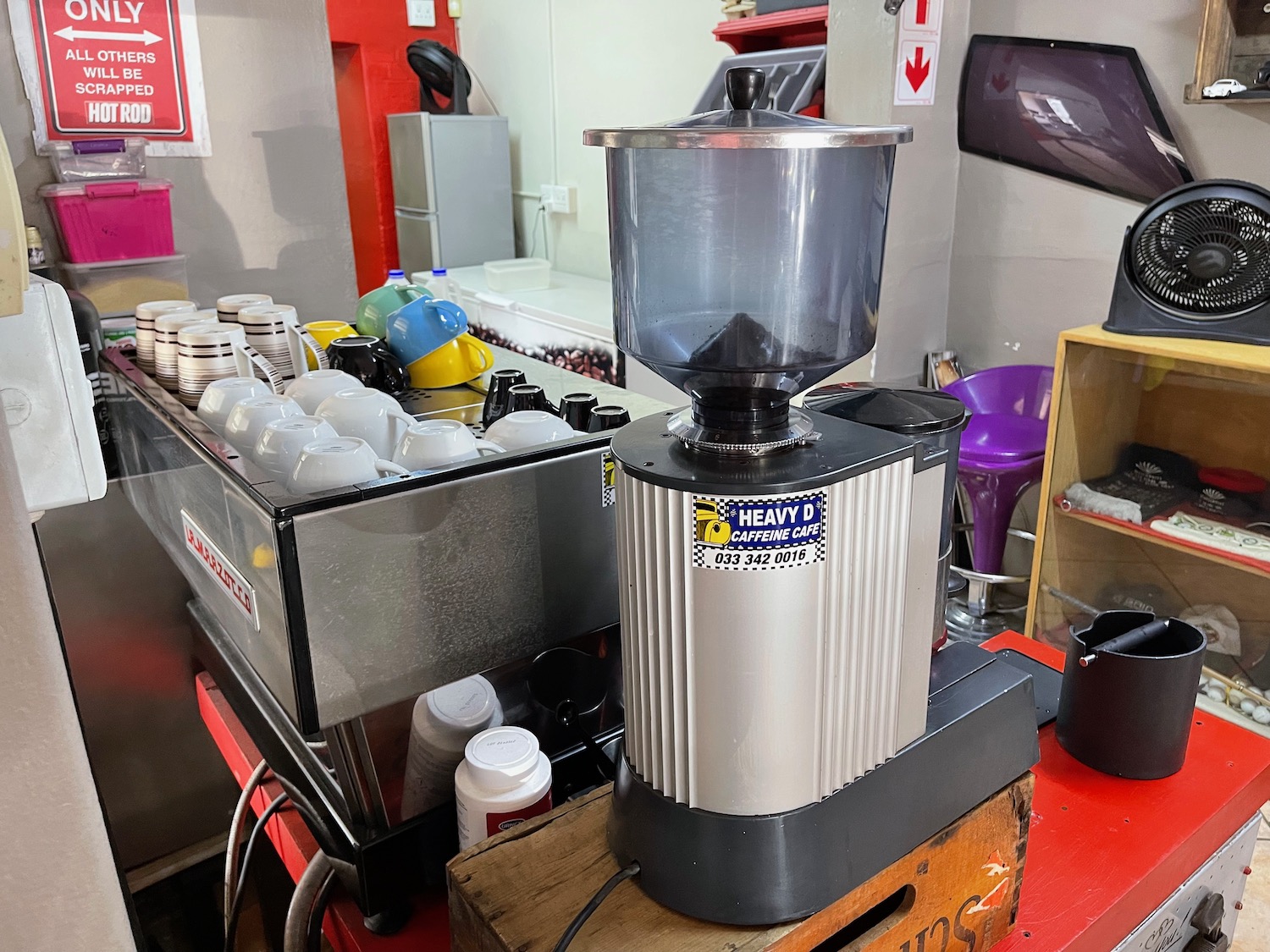 a blender and coffee cups on a counter