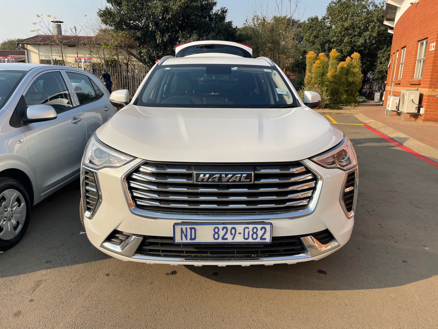 a white car parked in a parking lot