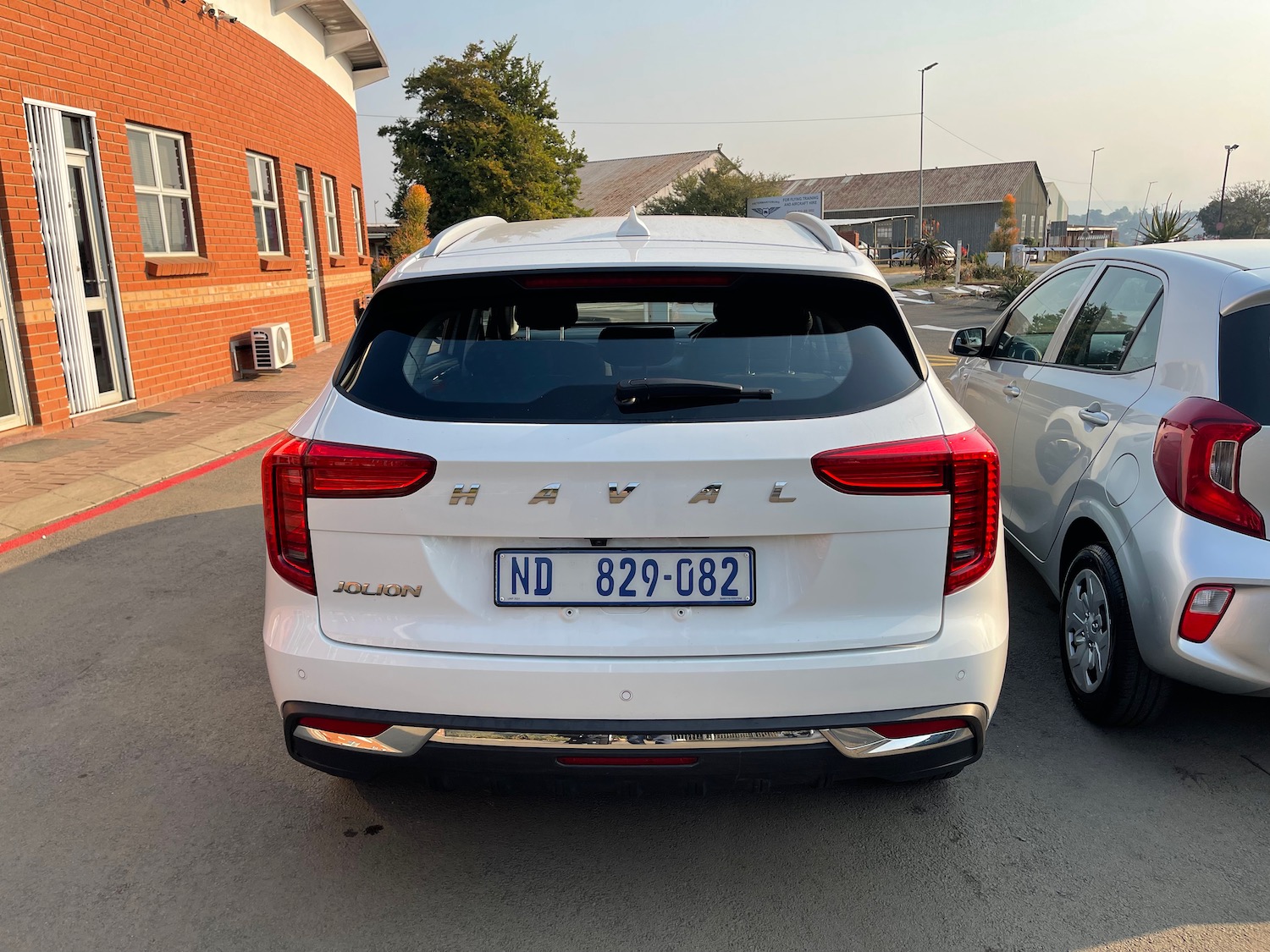 a white car parked in a parking lot