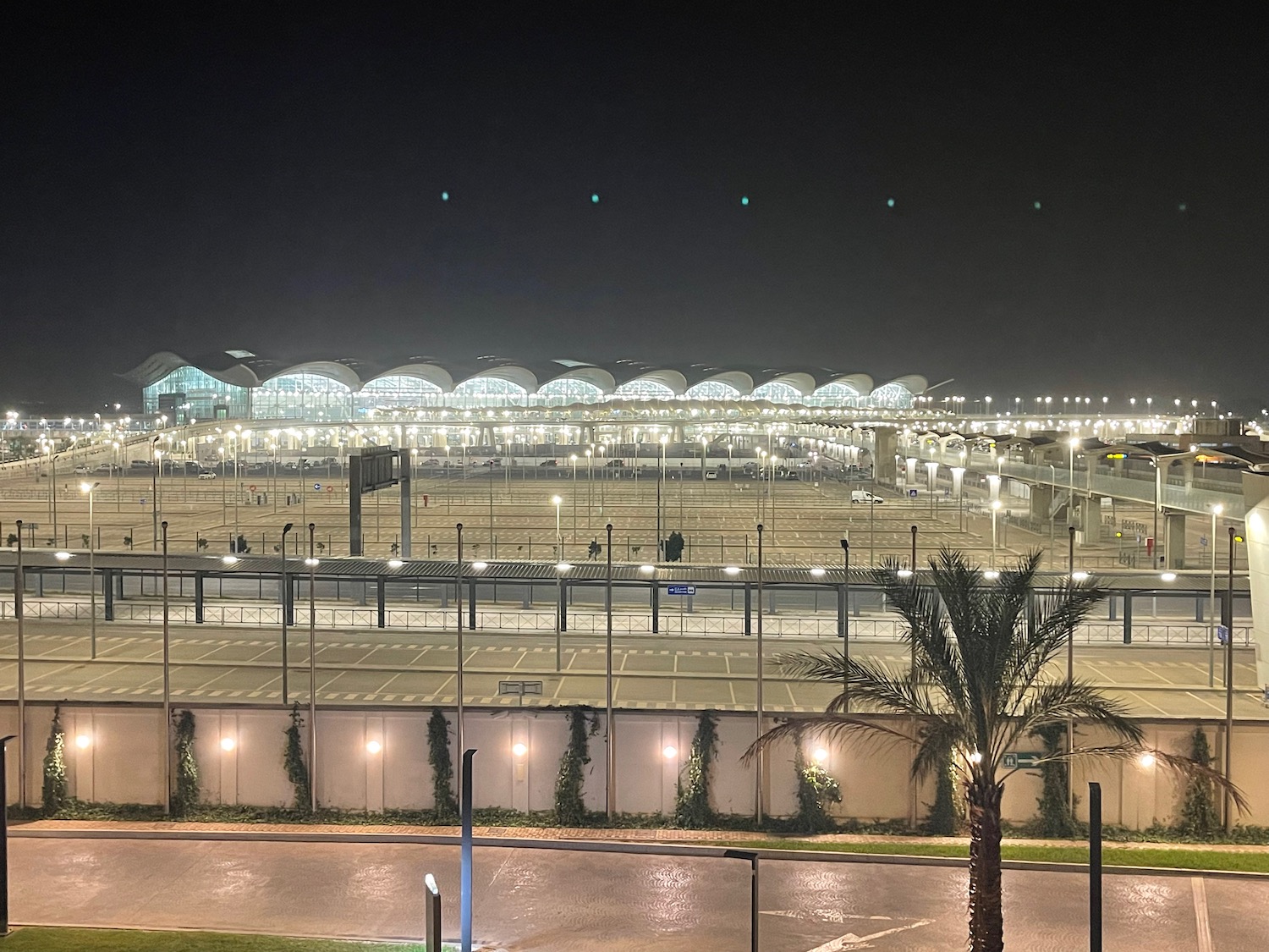 a large airport with lights at night