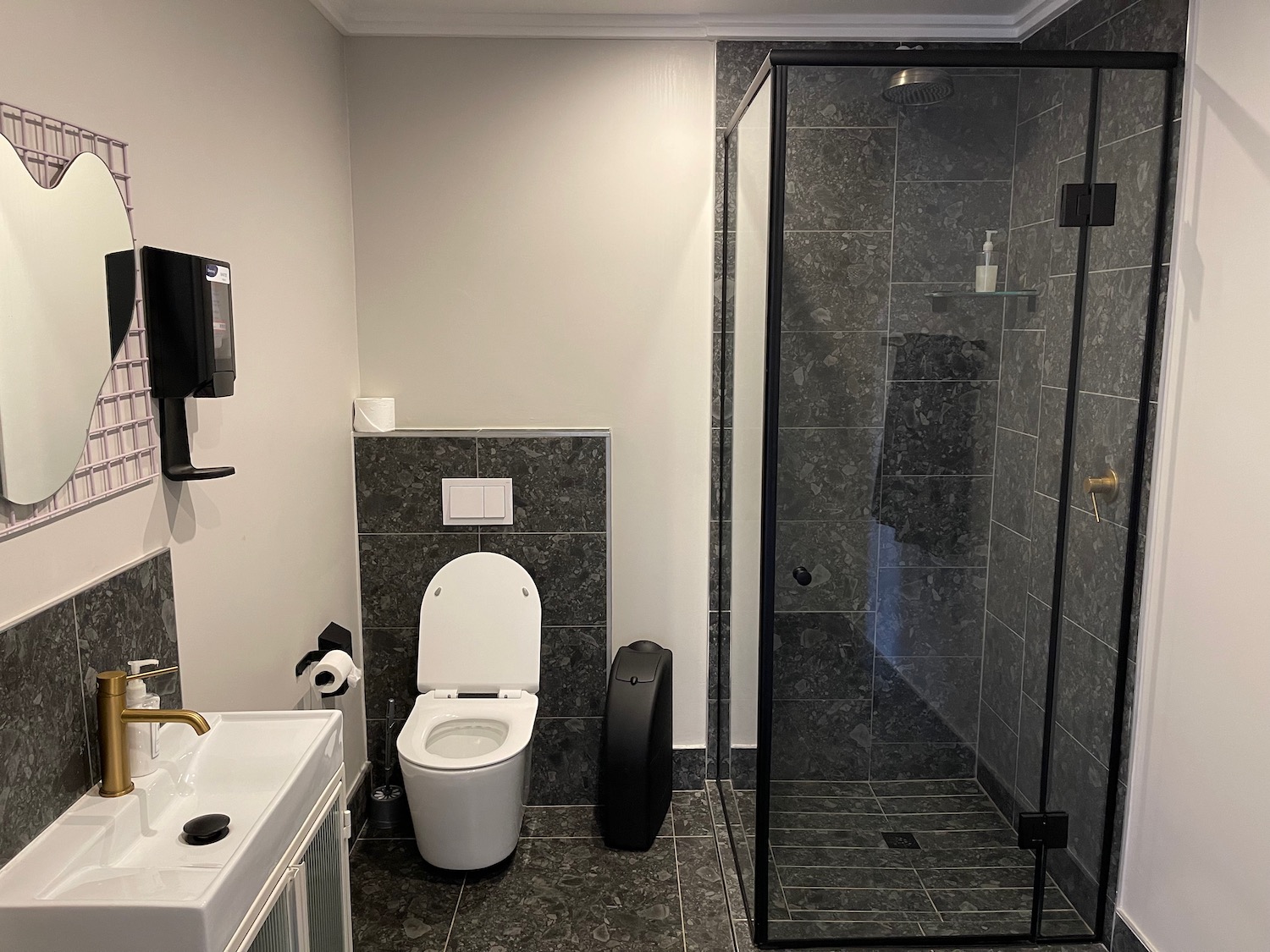 a bathroom with a toilet and shower