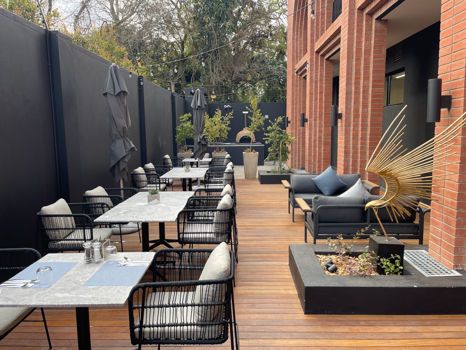 a patio with chairs and tables