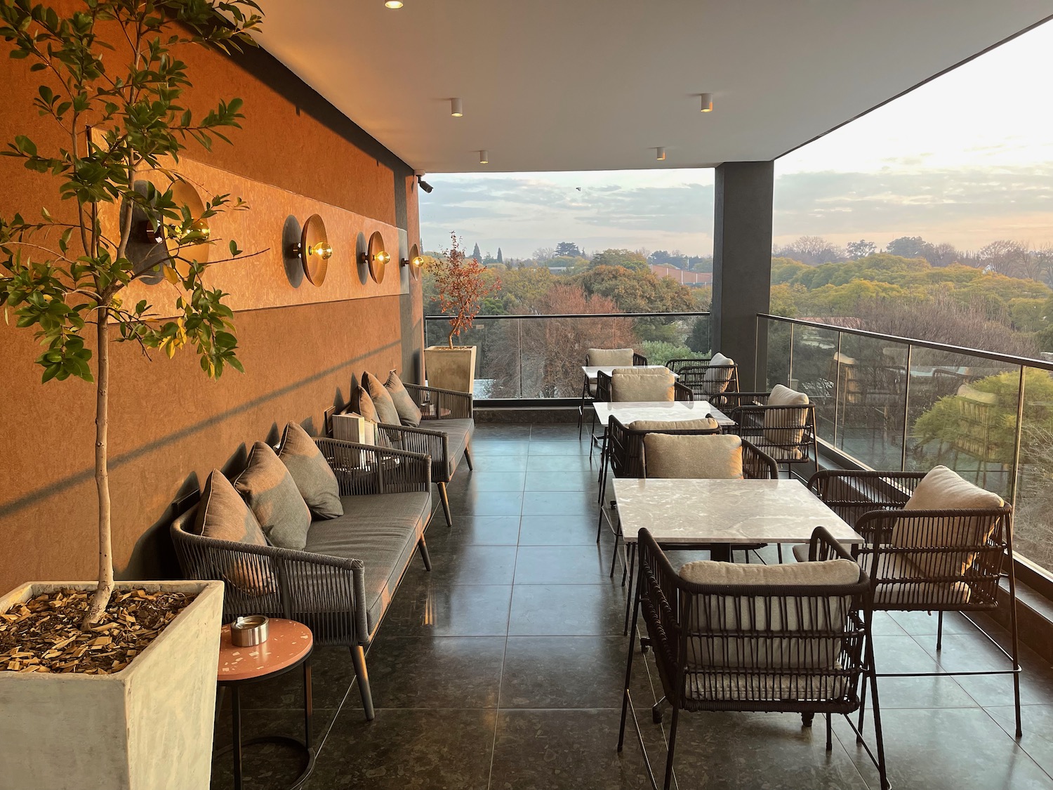 a patio with chairs and tables