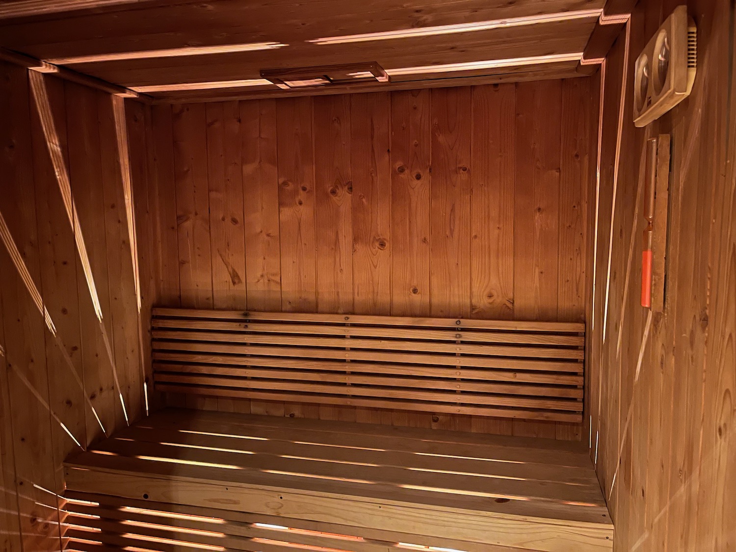 a wooden bench inside a wooden building
