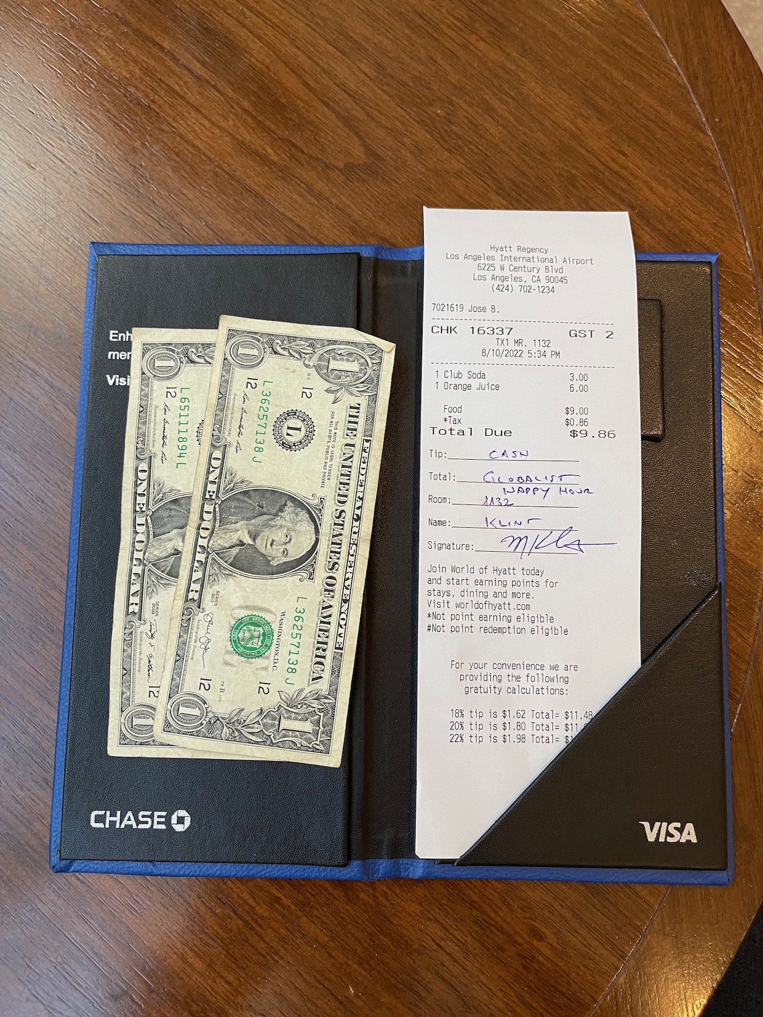 a bill and cash in a wallet