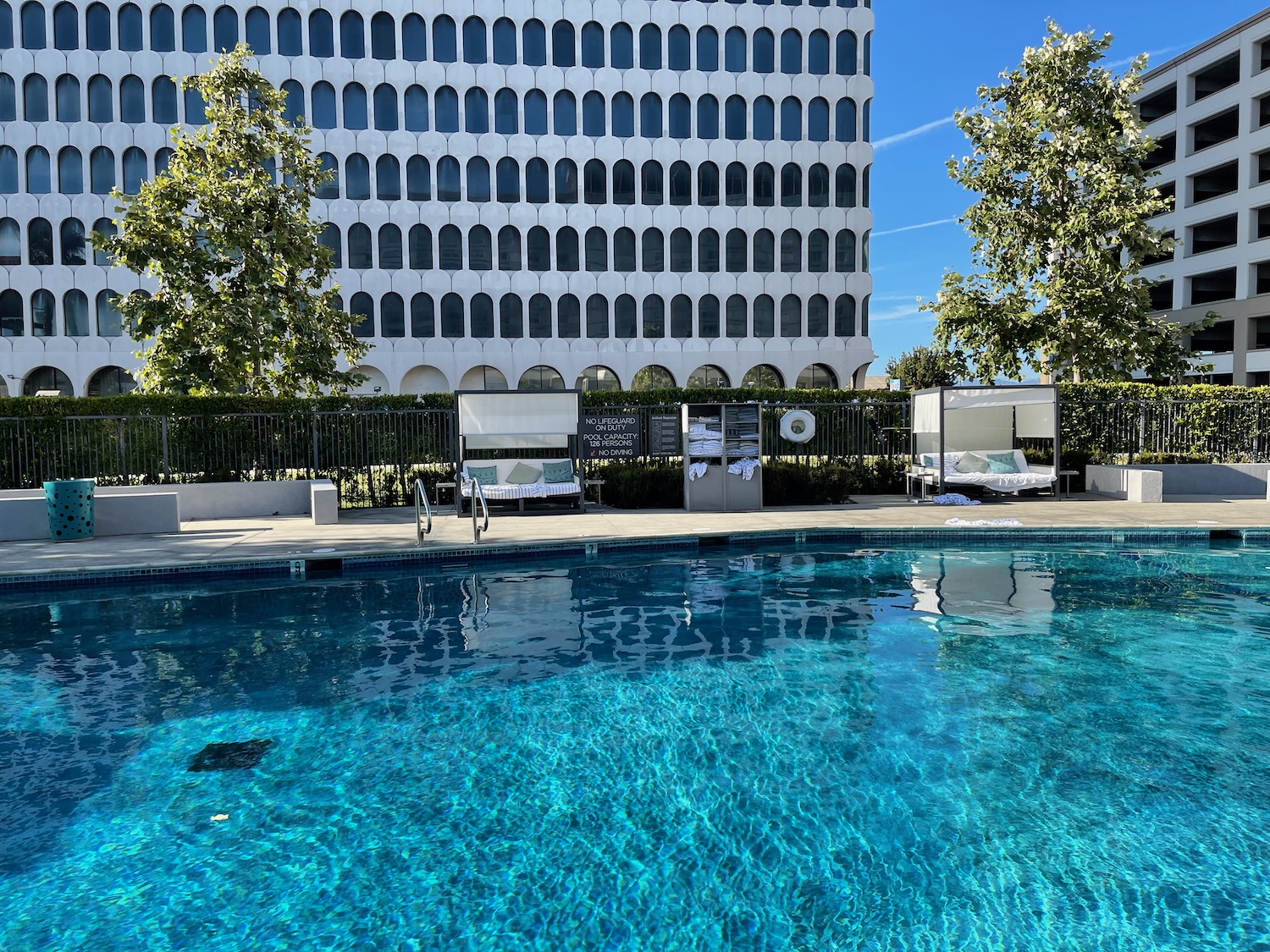 a pool with a building in the background