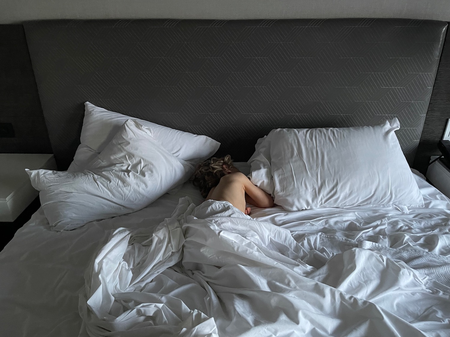 a child lying in a bed