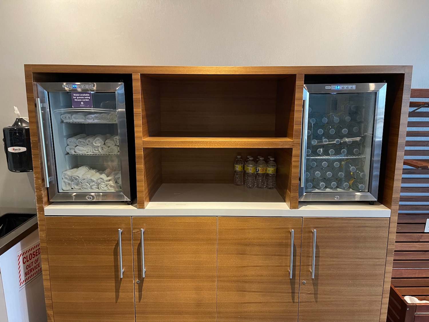 a two shelves with a beverage dispenser