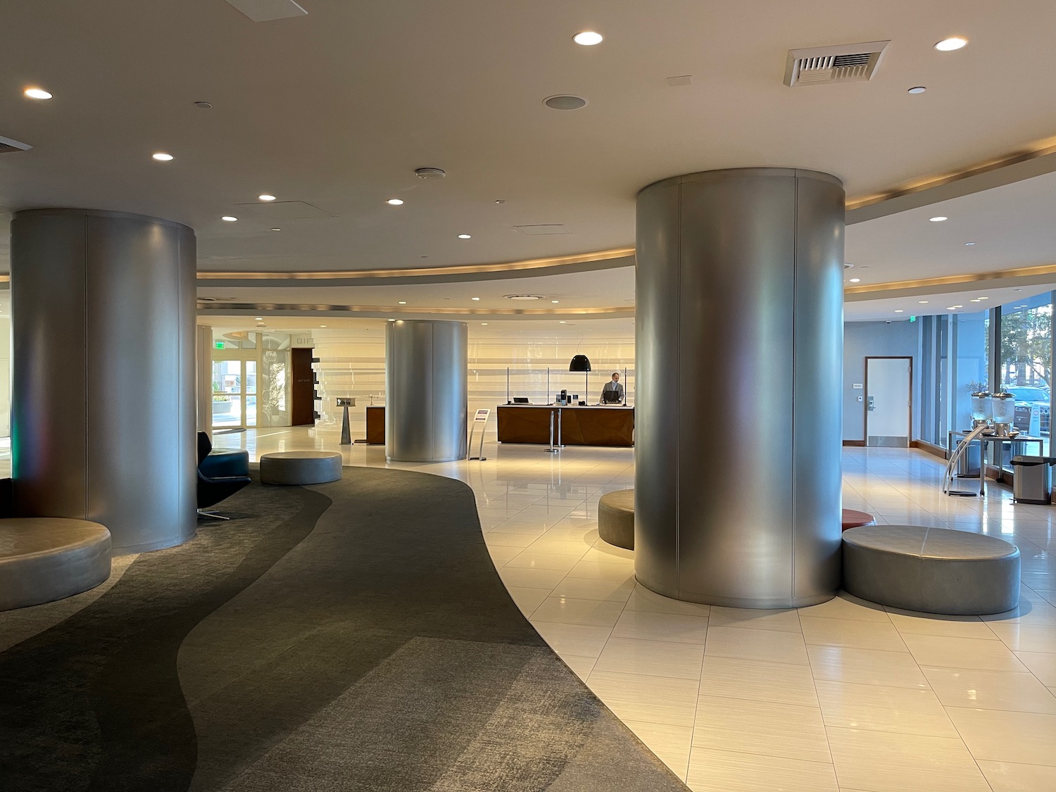 a lobby with a large silver pillar