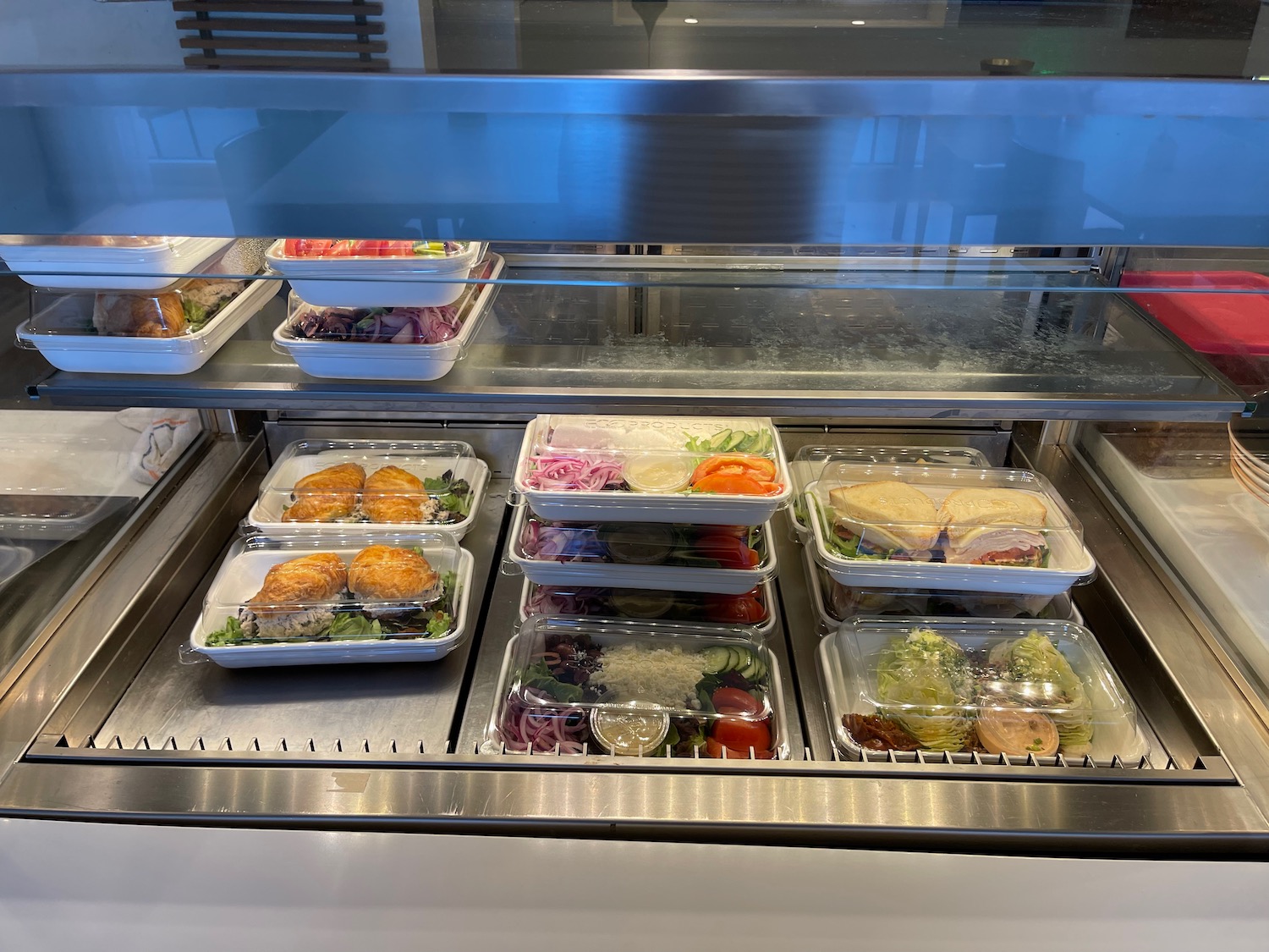 a trays of food in a display case