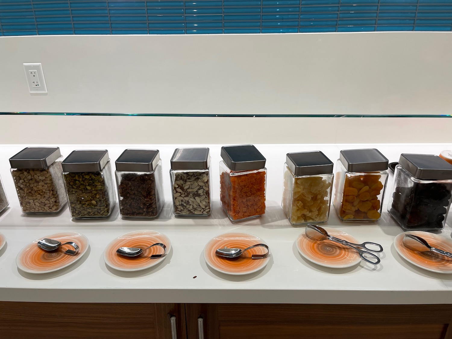 a row of containers with different types of food on a table