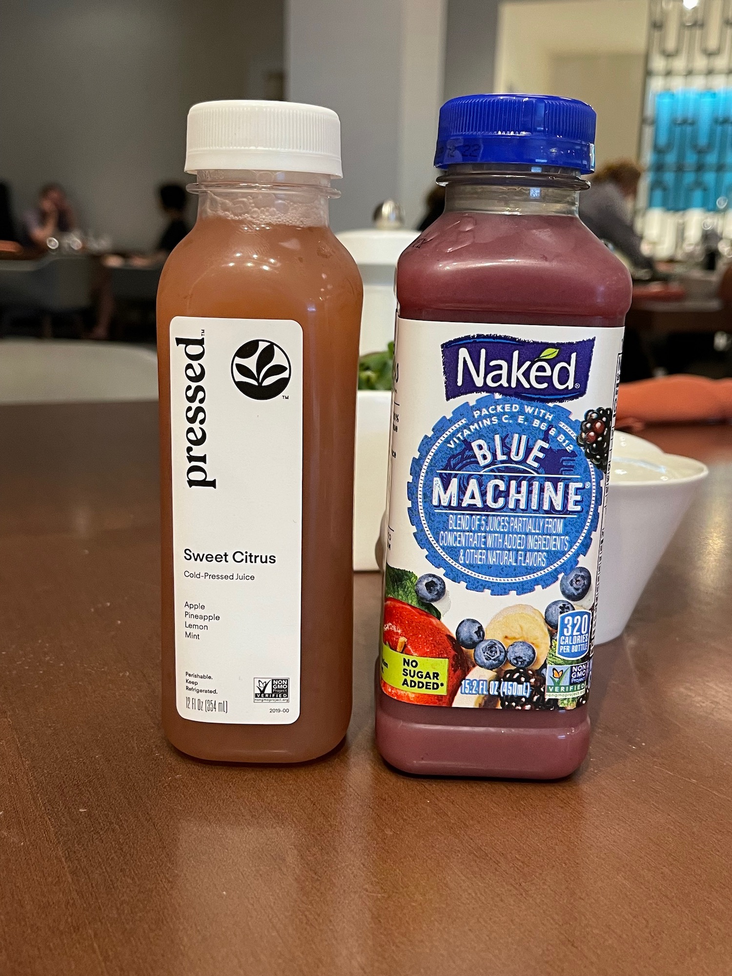 two bottles of juice on a table