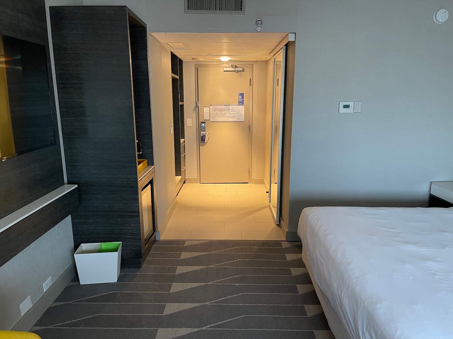 a hotel room with a door