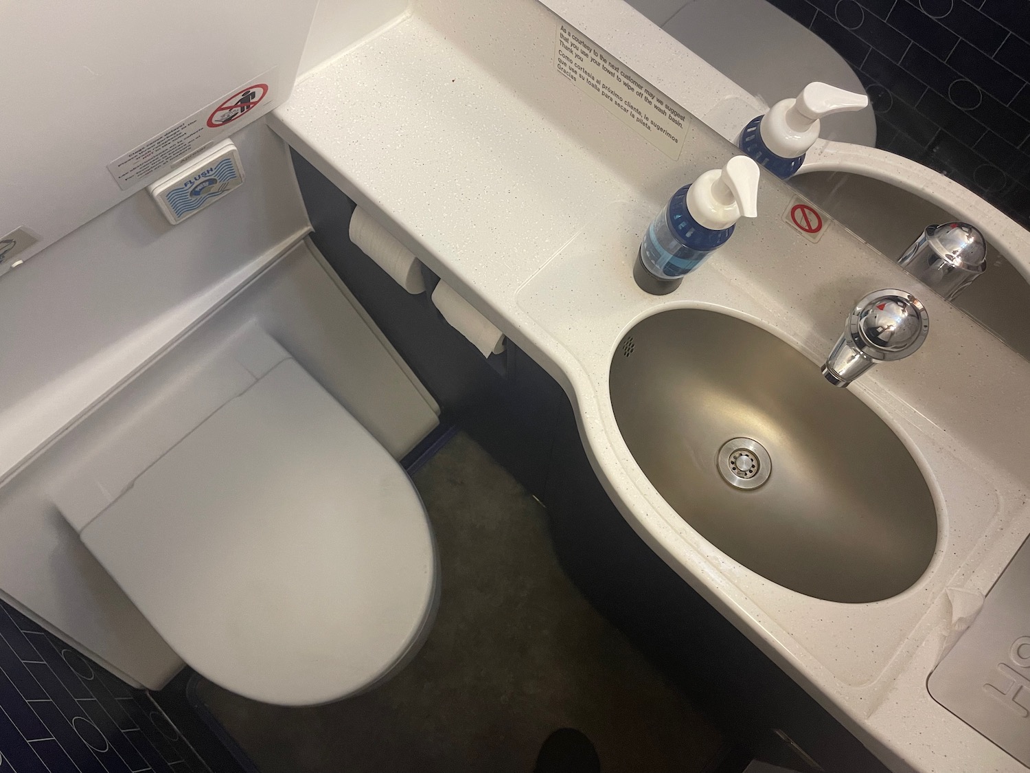 a sink and toilet in a plane